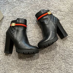 Black square heel boots.